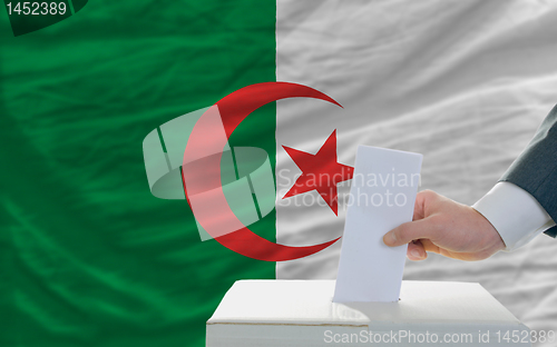 Image of man voting on elections in algeria