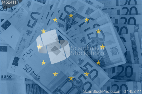 Image of flag of EU with transparent euro banknotes in background 