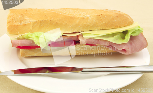 Image of Ham and cheese baguette side view