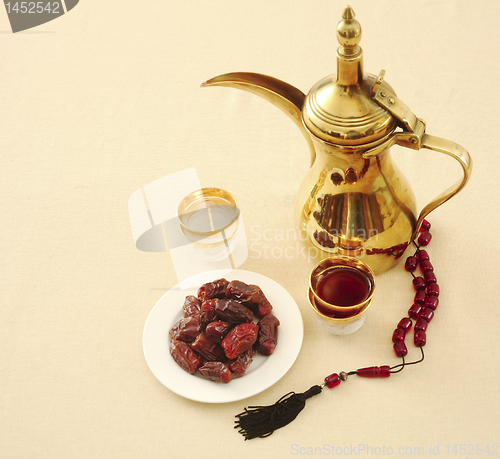 Image of Coffee, dates and prayer beads