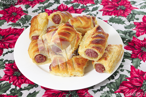 Image of Sausage rolls with tablecloth