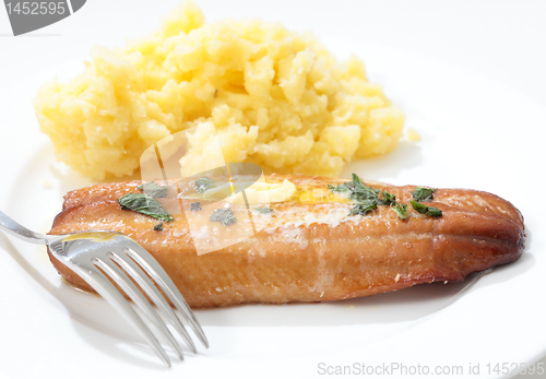 Image of Grilled kipper and mashed potato and fork