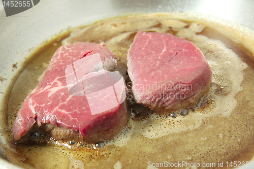 Image of Cooking filet mignon in frying pan