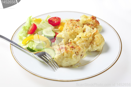 Image of Cauliflower cheese and salad with fork