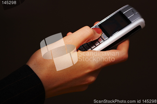 Image of Mobile phone with hand