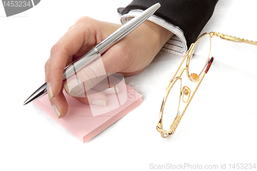 Image of  Womans hand with pen