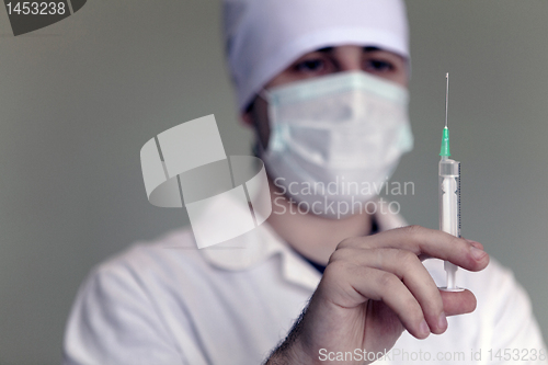 Image of Doctor with a syringe