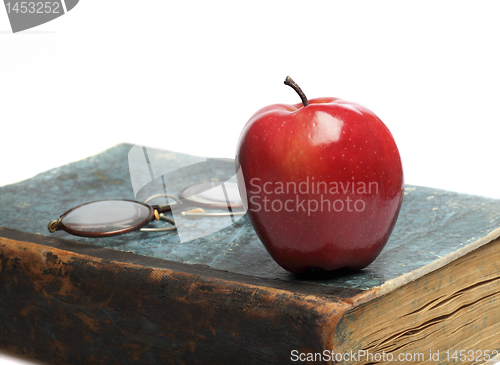 Image of Old Book with red Apple