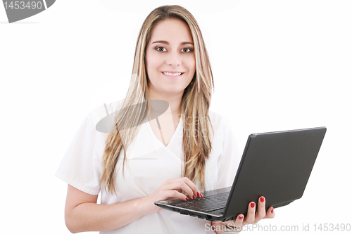 Image of Beautiful caucasian doctor or nurse holding a laptop computer