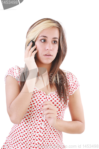 Image of Portrait of shocked woman talking on phone call over white backg