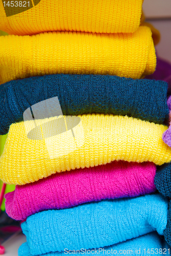 Image of pile of bright colored tights for children