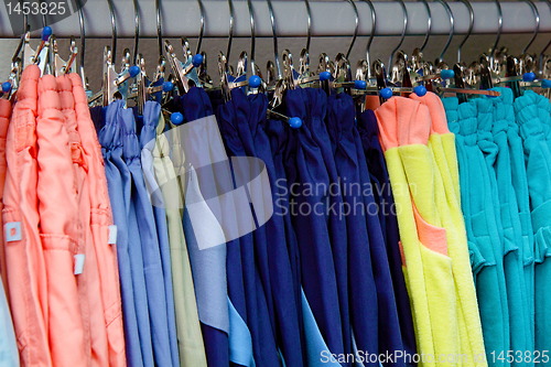 Image of children's trousers on a hanger in the store