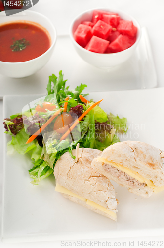 Image of tuna and cheese sandwich with salad