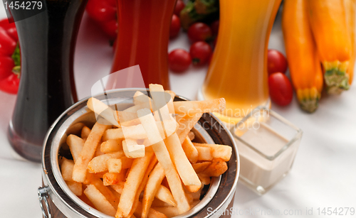 Image of fresh french fries on a bucket