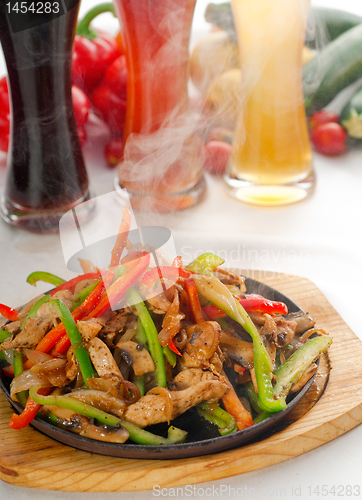 Image of original fajita sizzling hot  on iron plate