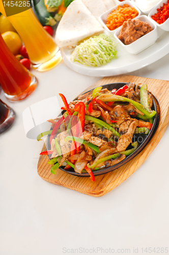 Image of original fajita sizzling hot  on iron plate