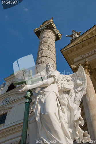 Image of Statue of an Angel with cross and snake