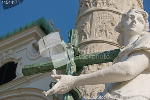 Image of Statue of an Angel with cross and snake