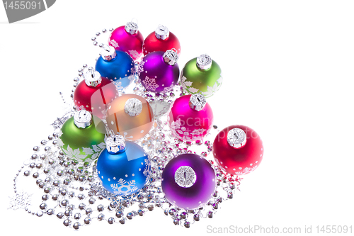 Image of christmas balls with snowflake symbols