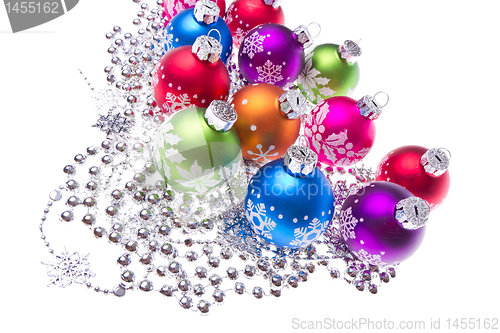 Image of christmas balls with snowflake symbols
