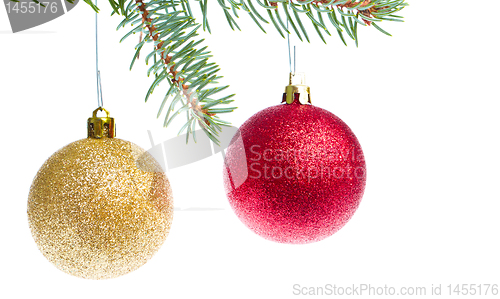 Image of red christmas ball hanging from tree