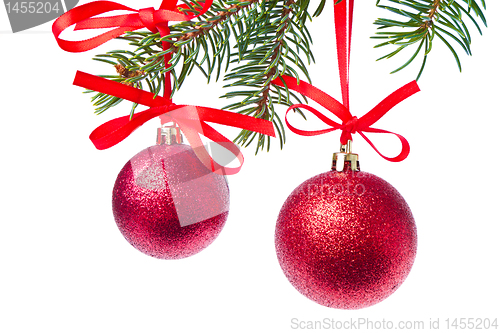 Image of red christmas ball hanging from tree