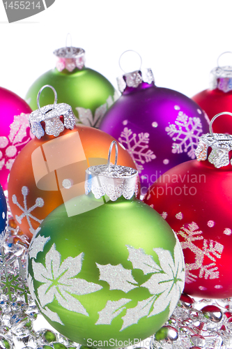 Image of christmas balls with snowflake symbols