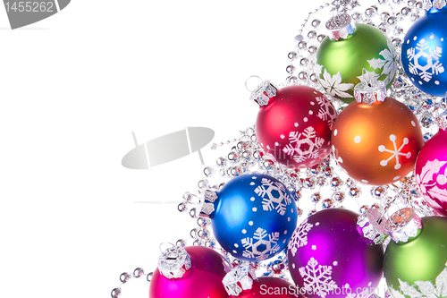 Image of christmas balls with snowflake symbols
