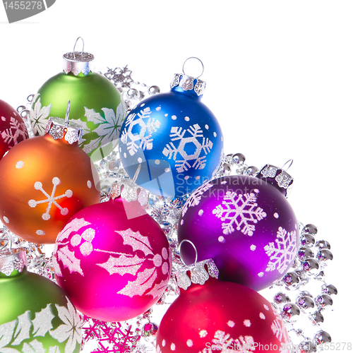 Image of christmas balls with snowflake symbols