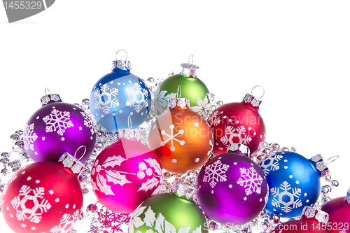 Image of christmas balls with snowflake symbols