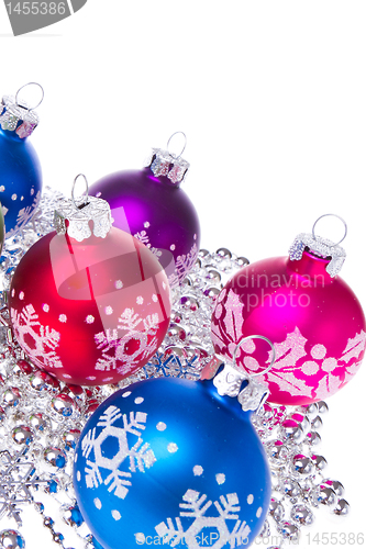 Image of christmas balls with snowflake symbols