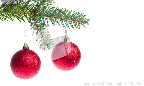 Image of red christmas ball hanging from tree