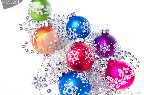 Image of christmas balls with snowflake symbols