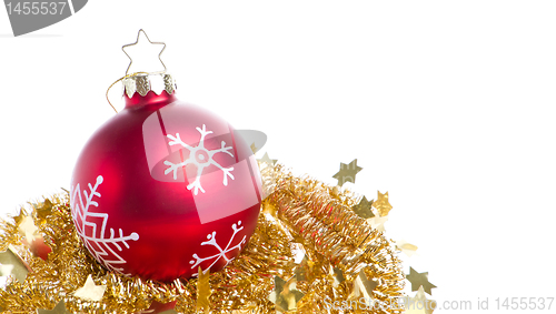 Image of christmas ball with snowflake symbols and tinsel