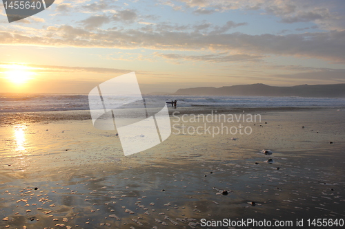 Image of sunset surfer