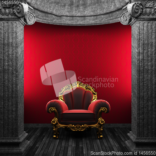 Image of stone columns, chair and wallpaper