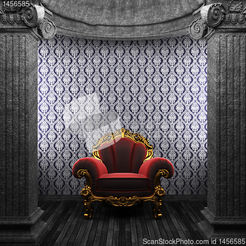 Image of stone columns, chair and wallpaper