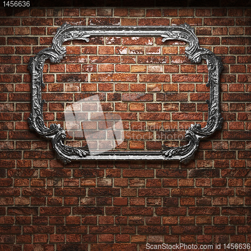 Image of illuminated brick wall and frame