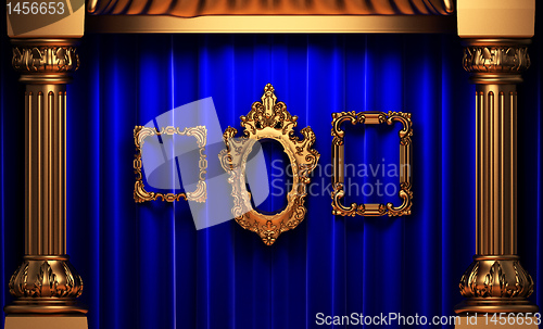 Image of blue curtains, gold columns and frames