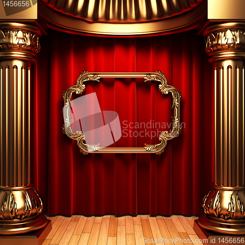 Image of red curtains, gold columns and frames