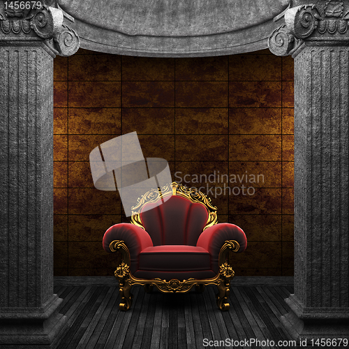Image of stone columns, chair and tile wall