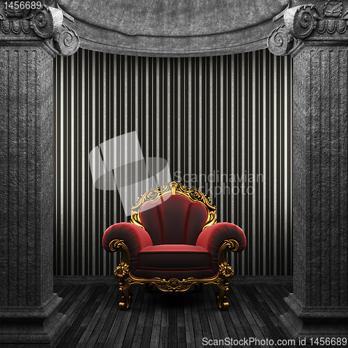 Image of stone columns, chair and wallpaper