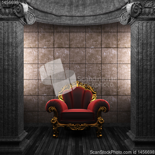 Image of stone columns, chair and tile wall