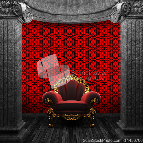 Image of stone columns, chair and wallpaper