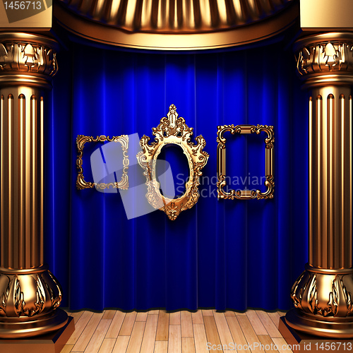 Image of blue curtains, gold columns and frames