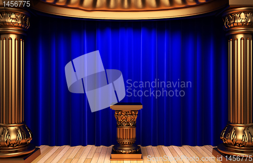 Image of blue velvet curtains, gold columns and Pedestal