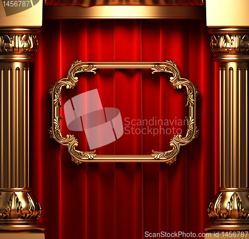 Image of red curtains, gold columns and frames