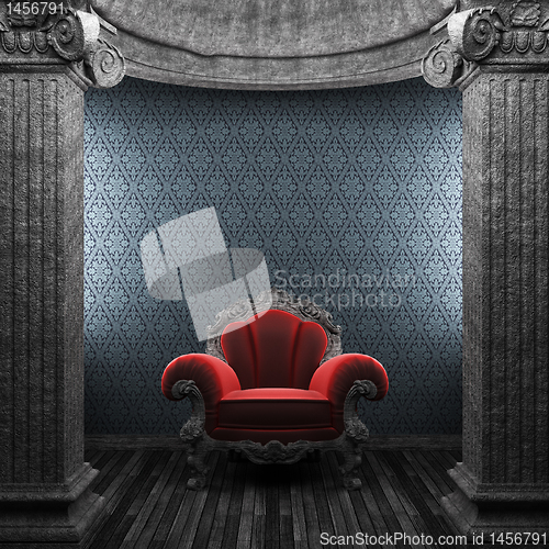 Image of stone columns, chair and wallpaper
