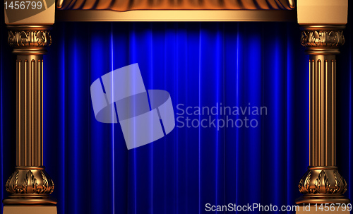 Image of blue velvet curtains behind the gold columns