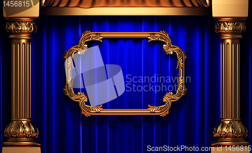 Image of blue curtains, gold columns and frames